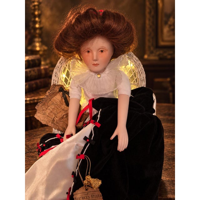Beatrice’s Atelier—a hauntingly elegant Franklin Heirloom vintage porcelain doll display featuring a glowing wicker chair,...