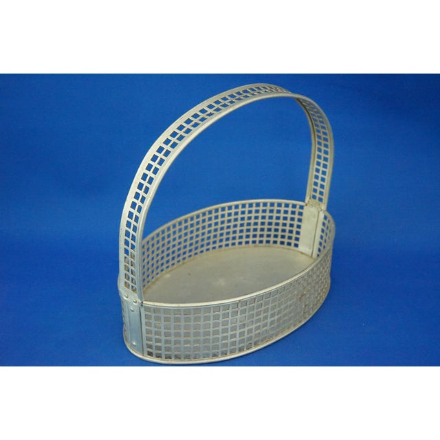 Description of the item: A wonderful aluminum basket made with a latticework pattern and a large central handle, also...