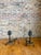 A handsome pair of vintage cast iron fireplace andirons featuring a detailed masted sailing ship atop a traditional...