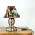 A wonderfully unusual vintage table lamp, most likely produced in Europe during the 1950s. The lamp features charming Snow...