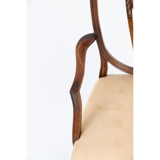 An elegant set of eight mahogany Hepplewhite style dining chairs, comprising six side chairs and two armchairs Circa 1920...