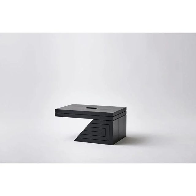 Ash coffee table sculpted by Lupo Horio¯kami Dimensions: D 44.9 x W 90 x H 60 cm Materials: Black ashwood, corten, brass...