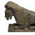 This is a fine carved naive sculpture depicting a recumbent lion. The lion is robustly carved with an expressive face and...