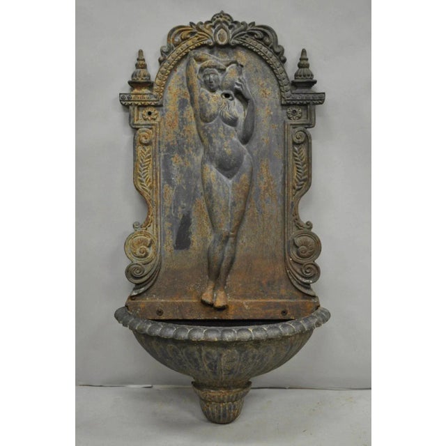 Vintage French Neoclassical Style Cast Iron "Nude Maiden" Wall Mounted Garden Water Fountain. Circa Mid 20th Century....