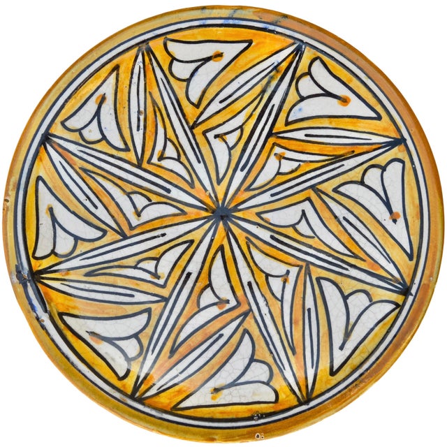 Late 19th Century meticulously handcrafted and glazed Moroccan decorative ceramic plate. The elaborate hand-painted add...