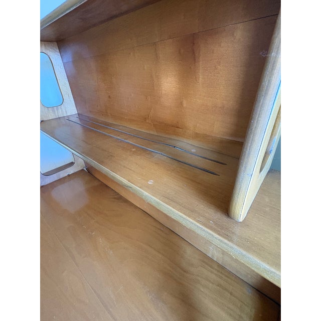 An exceptional piece of American design history. This sideboard/server with graduated two-tier open hutch was designed by...