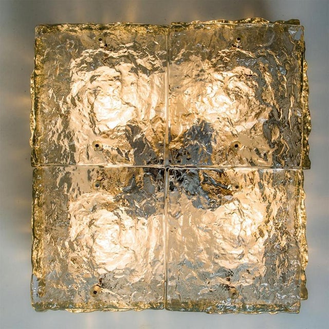 Rich texured square iced glass flush mount by kalmar, austria 1960. The flush mount has four thick textured glass panels...