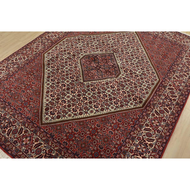 An authentic vintage traditional Bidjar rug hand-knotted with fine wool and natural dyes. This intricately woven rug...