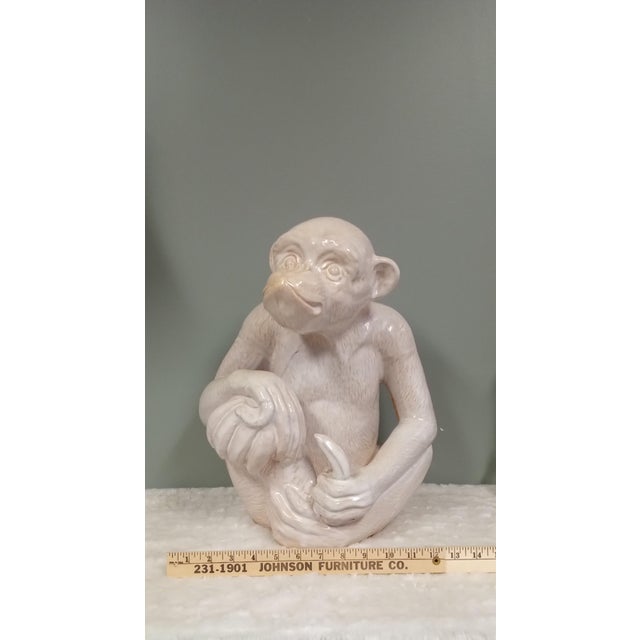 Absolutely stunning Texas estate sale find! This primate is eating his favorite treat. The glazed white pottery is in...