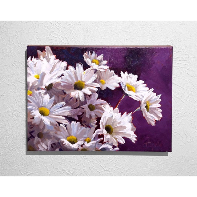 Bright white daisies burst forth against a rich, deep purple background, creating a vibrant contrast that exudes a sense...