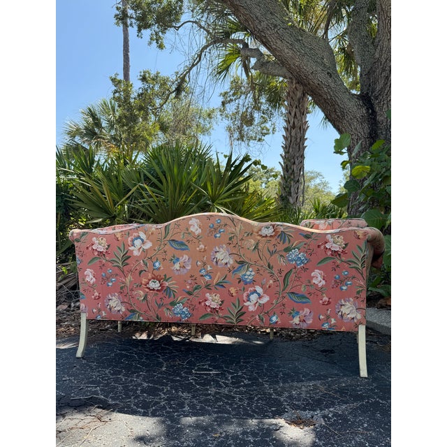 A beautiful vintage Mark Hampton for Hickory Chair camelback sofa featuring elegant floral upholstery, a beautifully...