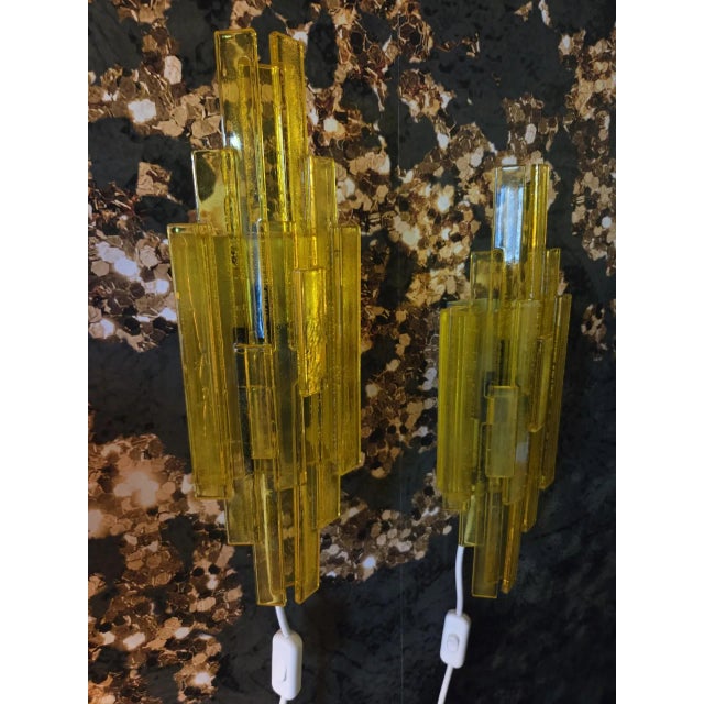 A pair of handmade wall lamps in yellow and green acrylic that really stand out and add personality to your home. the...
