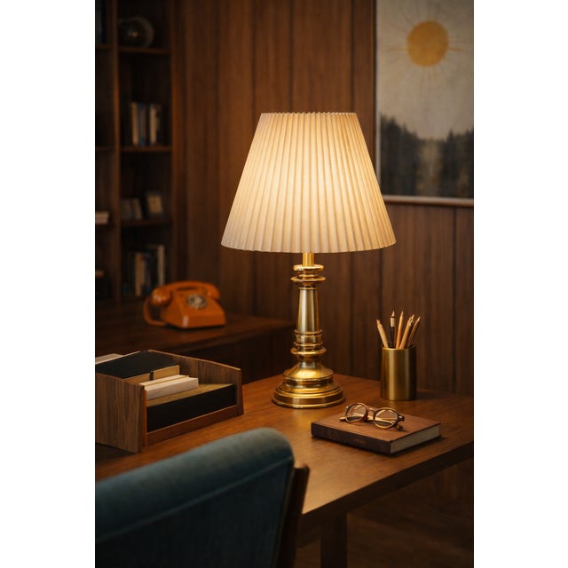This vintage Stiffel table lamp offers a timeless sense of balance and warmth, designed to anchor a room with quiet...