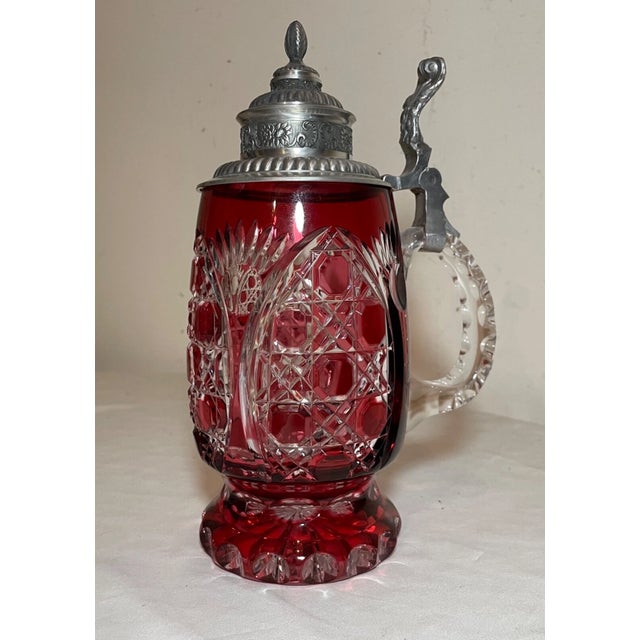 Up for sale is a high quality vintage cut to clear Bohemian Czech lidded glass beer stein. It's made out of thick ruby red...