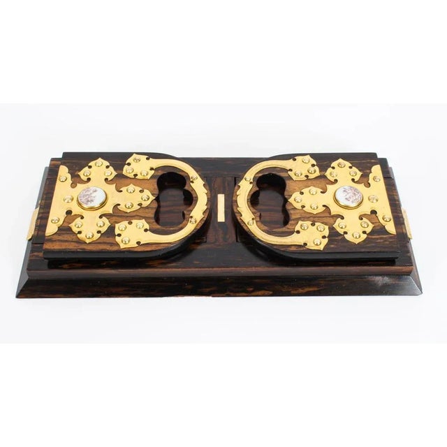 This is a wonderful and highly decorative antique Victorian ormolu mounted coromandel four piece desk set by the renowned...