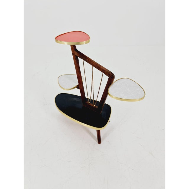 Small German plant stand, vintage mid-century minimalist indoor flower table, 1960s. Its extraordinary design is...