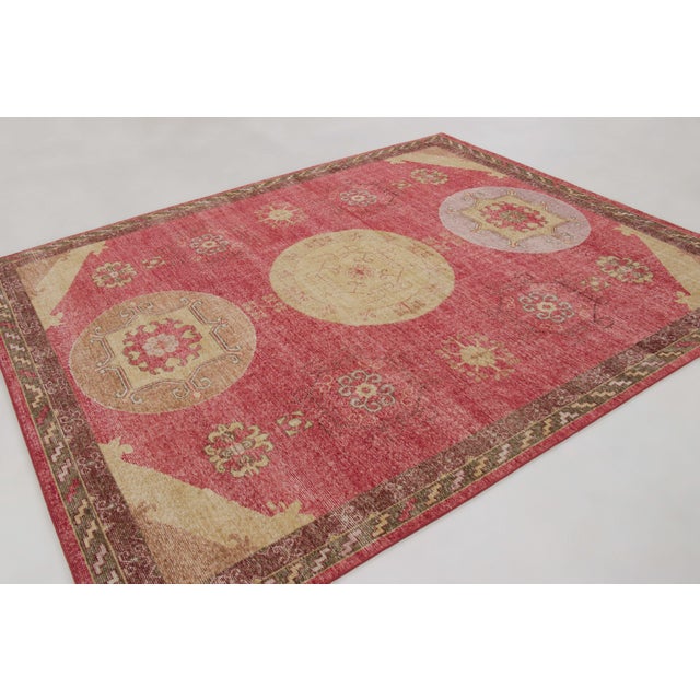Hand-knotted in wool, this 8x10 rug joins Rug & Kilim’s Distressed collection. It features a three-medallion Khotan design...