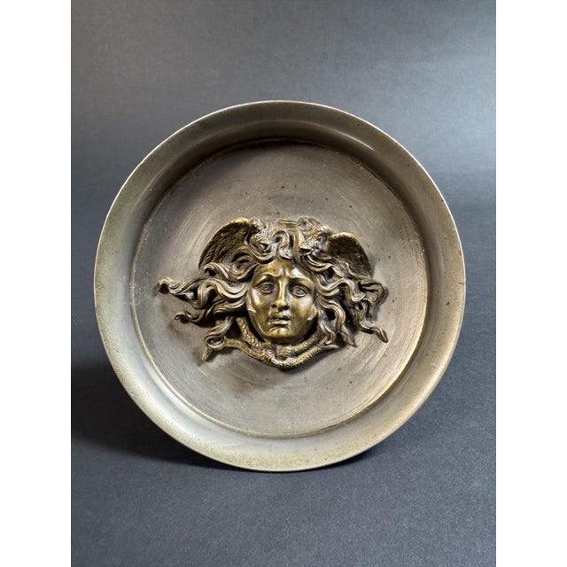 Decorative cake stand by Vincenzo Gemito, 19th century. The cake stand features a distinctive and detailed bronze bas-...