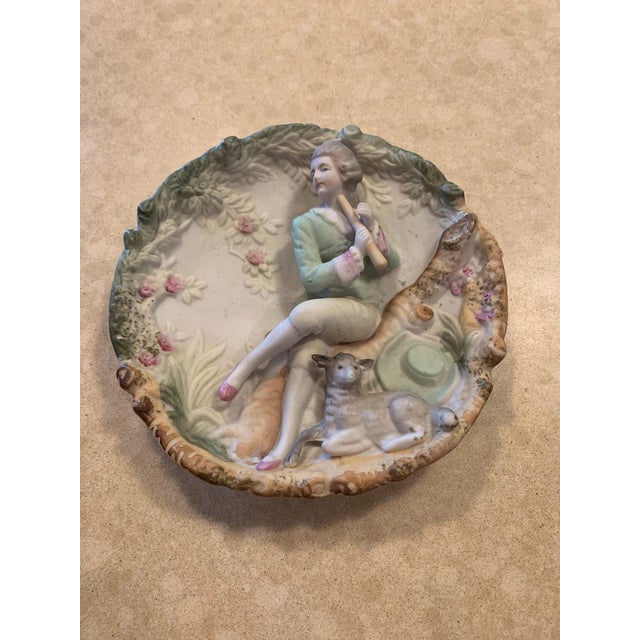 Set of 2 depictions of Victorian-era figures. One was made in "occupied Japan" between 1945-1952. Other is also made in...