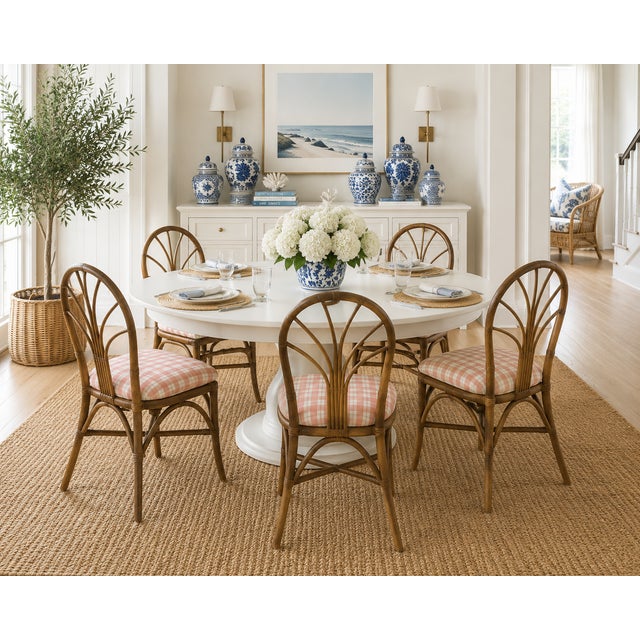 Elevate your dining space with this stunning set of six (6) vintage rattan dining chairs. Featuring a classic "wheatback"...