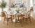 Elevate your dining space with this stunning set of six (6) vintage rattan dining chairs. Featuring a classic "wheatback"...