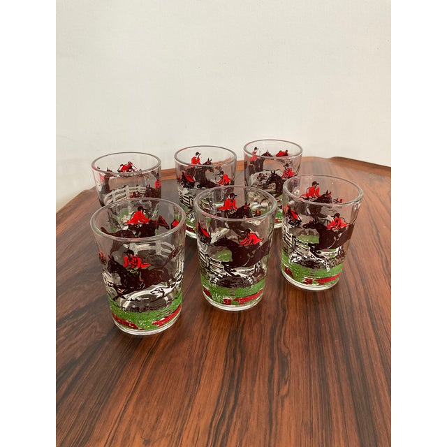 Gallop into your next cocktail hour with this quintessential mid-century Hazel Atlas "Fox Hunt" glassware set. This...