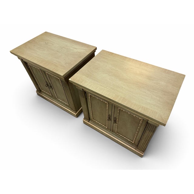 Complete your bedroom retreat or elevate your living room flanking a sofa with this exceptional matching pair of vintage...