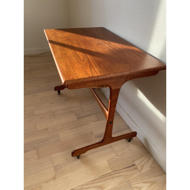 This small vintage teak sewing table impresses with its beautiful, vibrant wood grain and a flawless, original basket....