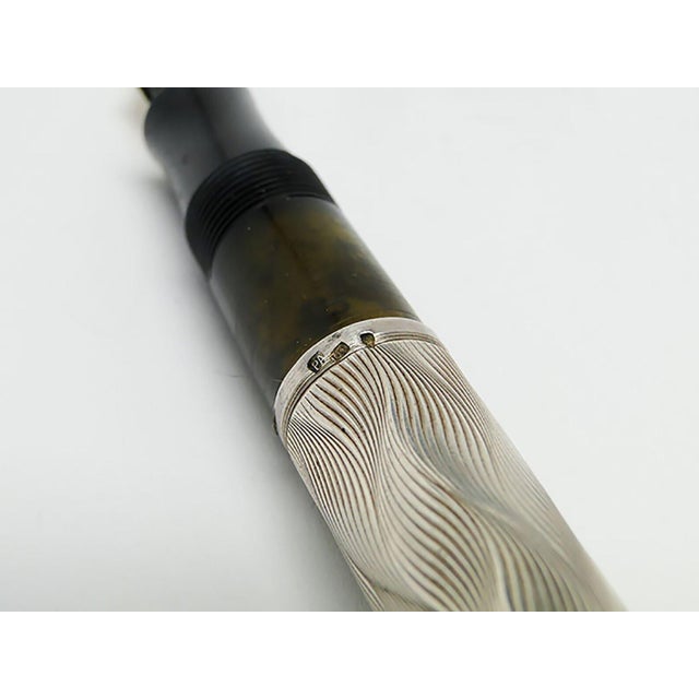 Pen made of silver. It was made in Germany. Sample : 900 The silver part consists of three elements. Very good condition....