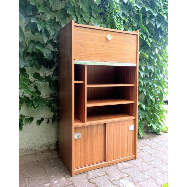 A design registered by Berlioz Furniture in the 1970s. The top shelf is the perfect size for your record player. We love...