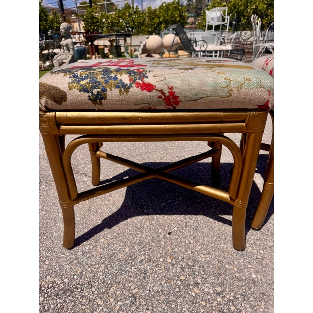 Fun vintage pair of bamboo stools finished in a softly aged painted gold finish and newly upholstered in Regal Fabrics...