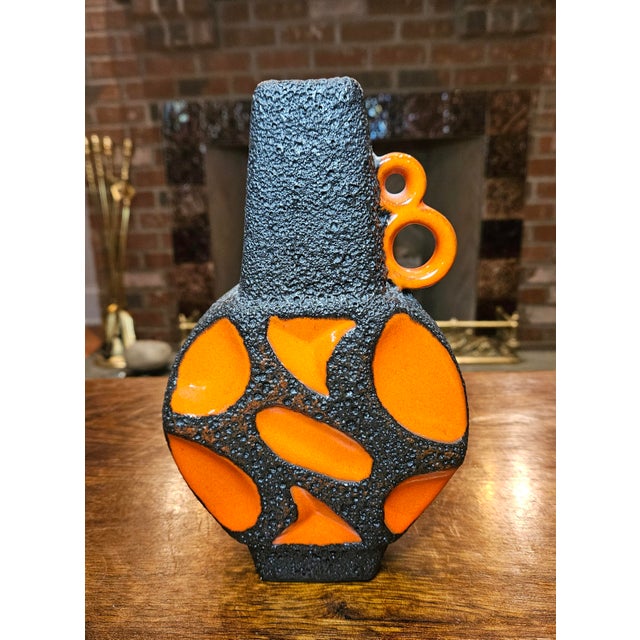 This beautiful orange and black vintage "Banjo Vase", model 313, was produced by the West German manufacturer Roth Keramik...