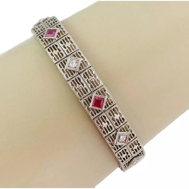 This lovely Art Deco bracelet is crafted form 18k white gold with a beautiful milgrain and filigree design. It is 10.5mm...