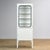 Vintage medicine cabinet from the 1970s, produced in Hungary. This cabinet is made of iron and glass, with the glass held...