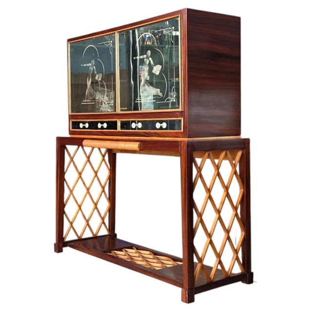 This is a classic Art Deco bar cabinet likely dating back to the 1930s or 1940s. This style is highly sought after by...