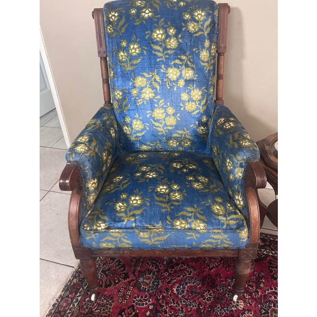 Beautiful antique Victorian Eastlake parlor chair with stunning blue floral velvet upholstery, burl wood accents, and...