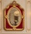 This elegant mid-20th-century French Louis XVI–style wall mirror combines neoclassical symmetry with rich gold leaf and...