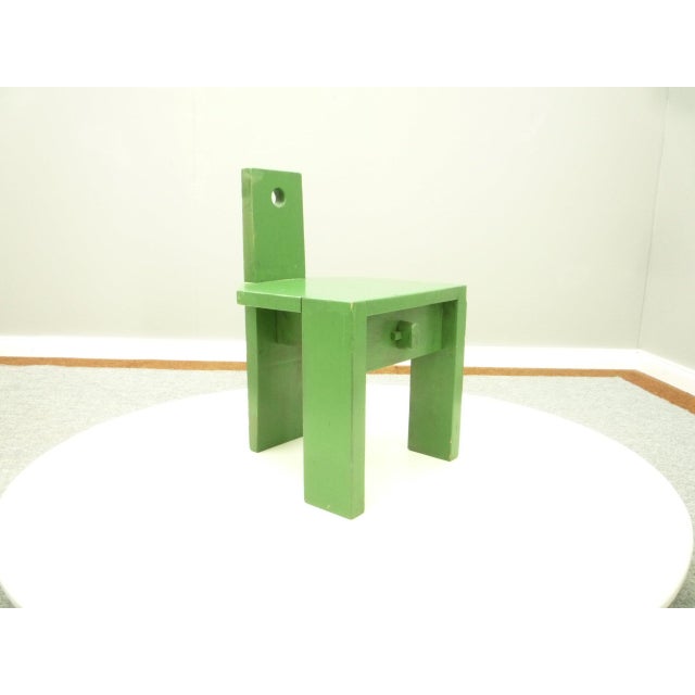 Rare Bauhaus style children's chair. Manufacturer unknown. Material solid wood and then painted green. The chair is stable...