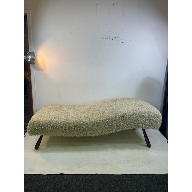 Beautiful Chaise Lounge With Faux Sheepskin Designed in The Manner Of Jean Royere. Resting Upon Exotic Wood Ball And Stick...