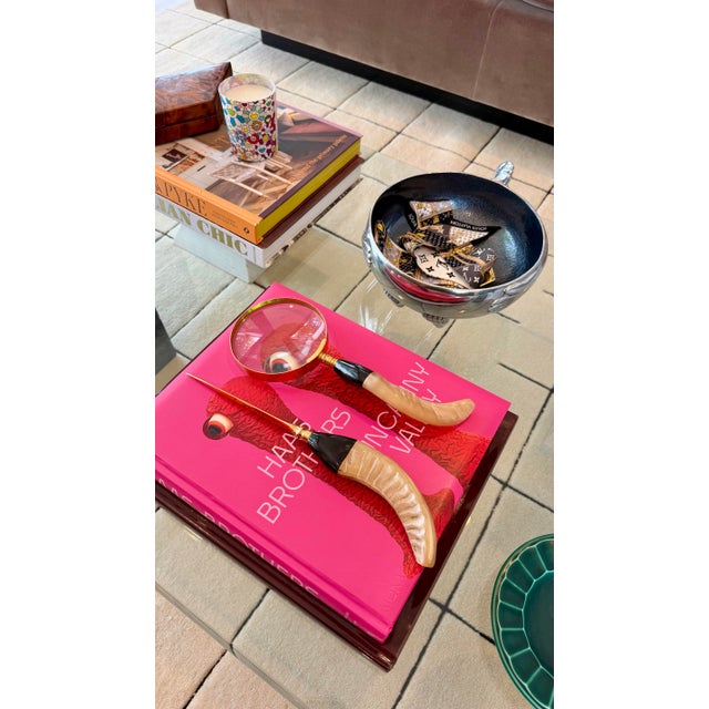 We are very pleased to offer this elegant pair of vintage desk accessories, circa 1970s, featuring a magnifying glass and...