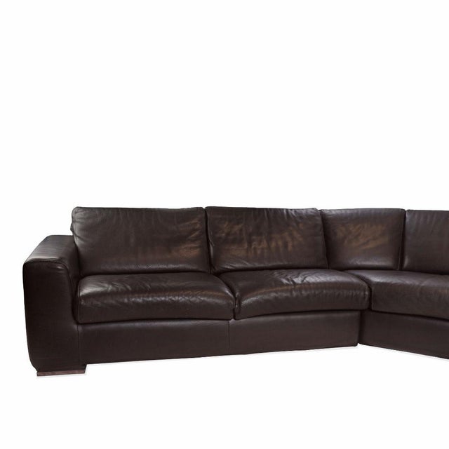 This Modern Leather Sectional Sofa by Maurice Villency offers a sleek and comfortable seating solution with a clean,...