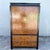 This vintage chinoiserie armoire by Century Furniture pairs luminous burlwood with a sleek black frame for striking East-...