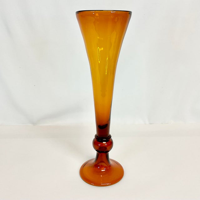 Vintage Home is pleased to offer this stunning Vintage Handblown Trumpet Vase. It stands 15” tall and is a gorgeous Amber...