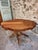 Antique French walnut violin table dating from approximately 1880–1900, featuring a shaped violin-form top and a central...