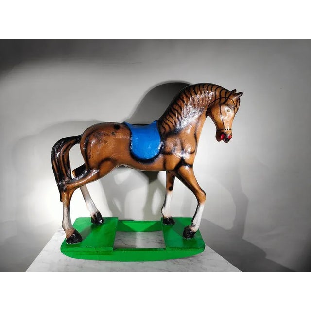 Decorative rocking horse made of papier-mâché, 1950s Measurements: 70 x 28 x 59 cms.