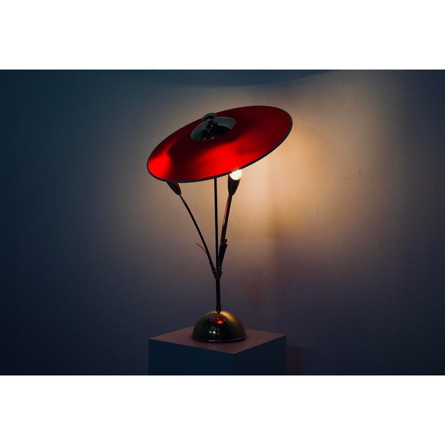 Pair of three-arm lamps in solid brass, topped with adjustable woven plastic shades. Royal Kelma (Leuchten) edition, circa...