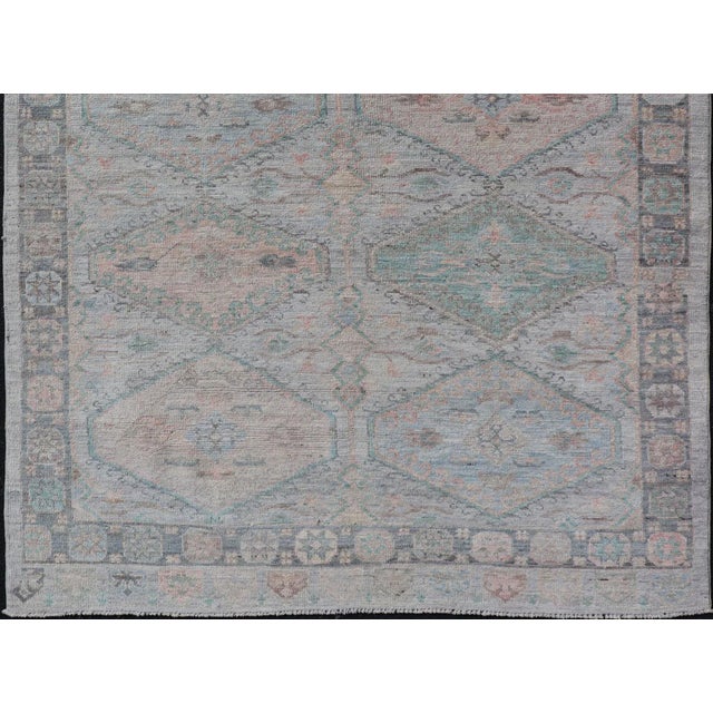 Measures: 4'11 x 6'3 Large Medallion Design Modern Oushak on a Light Blue Field With Multi Colors. Keivan Woven Arts; rug...