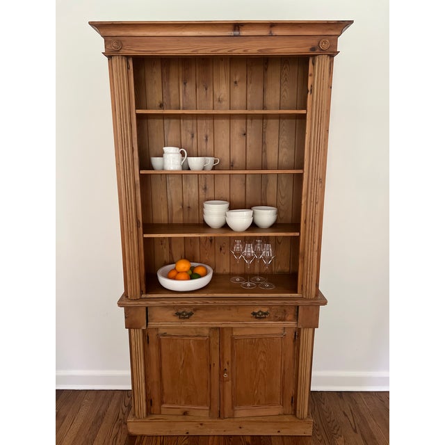 Beautiful antique pine stepback hutch with a warm, naturally aged honey-pine finish and wonderful architectural detailing....
