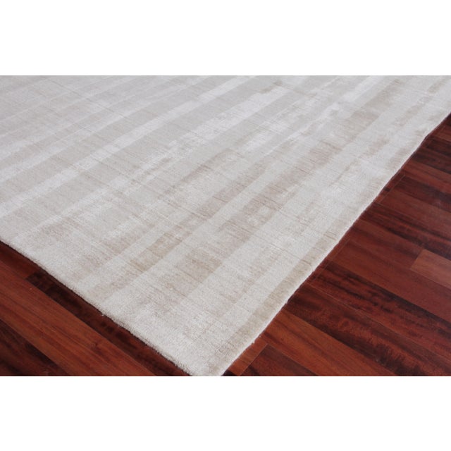 The linear tonal design of the Iscar rug is at once casual, chic and ultra sophisticated. Made of luxurious bamboo silk,...