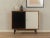 Wonderful chest of drawers from the 1960s. Body in teak veneer with two Formica-coated doors in black and cream white, two...